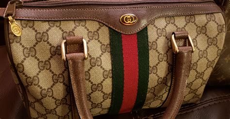 how can i tell if my gucci bag is real|gucci purse real.